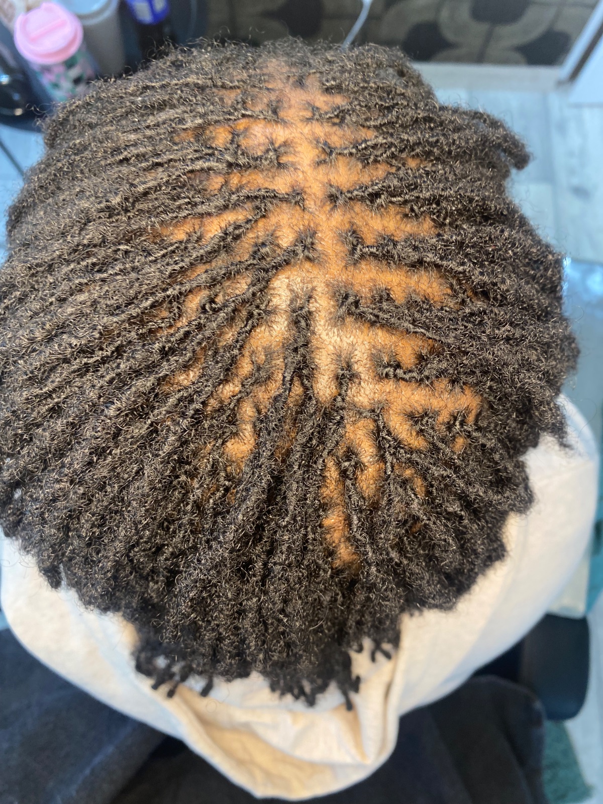 Coloured locs with a freshly retouched crown, done at The Honey Lounge